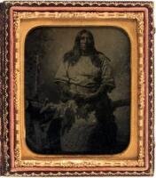 Ambrotype of a Native American woman, in studio setting mimicking the outdoors, in leather case with strapwork design