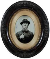 Tintype of a bearded gentleman in uniform, with the buttons tinted with gold