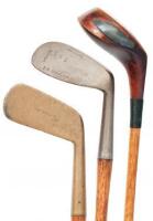Three hickory golf clubs
