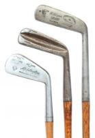 Three hickory golf clubs