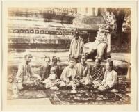 Original albumen photograph of a Burmese family seated in front of a temple, captioned "The Beauties of Sagaing"