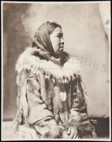 Photograph of an Eskimo Woman dressed in furs, a scarf on her head