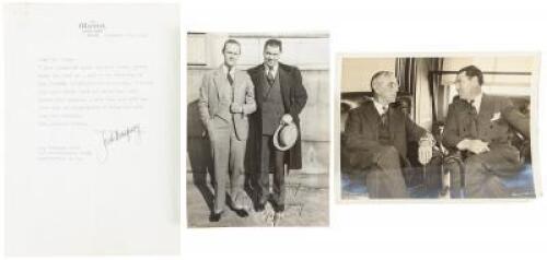 Photograph of Jack Dempsey and Truman Young standing arm in arm, inscribed and signed by Dempsey to Young