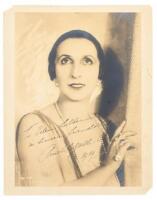 Inscribed studio photograph of Italian coloratua soprano Amelita Galli-Curci, along with 3 snapshot photographs of her and a book about her