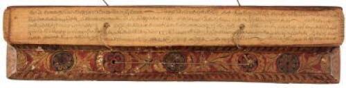 Handwritten religious text on palm leaves, with uncommon polychrome painted wood covers, bound in the traditional style with string through holes in the leaves