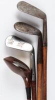 Four wood-shafted golf clubs