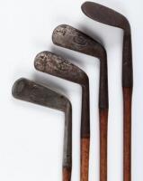 Four hickory-shafted golf clubs