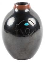 Black jar with two inset turquoise stones