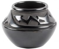 Black jar with deeply incised design