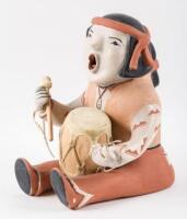 Ceramic figure of a man with drum and mallet