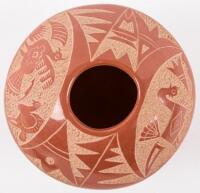 Small red pot with carved turkey designs