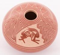 Small seed pot with carved designs