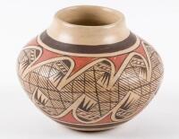 Small ochre pot painted in red and black