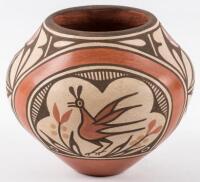 Large painted red pot with bird designs