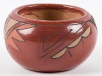 Small red pot with painted designs