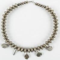 Silver necklace of beads made from Indian Head Nickels