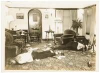 Eight original photographs taken at the crime scene of a murder at a beach house on Erland's Point, near Bremerton, Washington