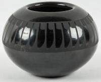 Small black pot with etched feather design