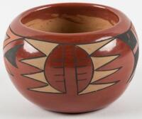 Small red pot with painted designs