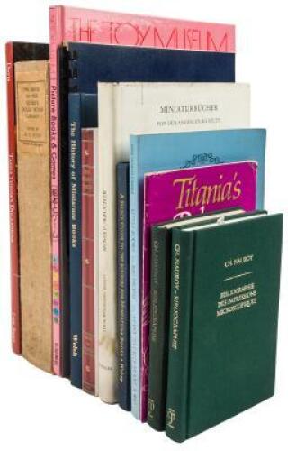 Eleven volumes of miniature book reference material