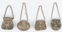 Four silver filigree cases, perfect for a small volume