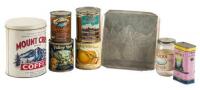 Seven cans and jars with mountains scenes on labels