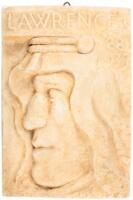 Relief carving of T.E. Lawrence in profile, wearing a keffiyeh
