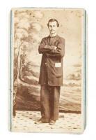 Civil War-era Carte-de-Visite photograph of an unknown man in civilian garb, standing in front of a scenic background