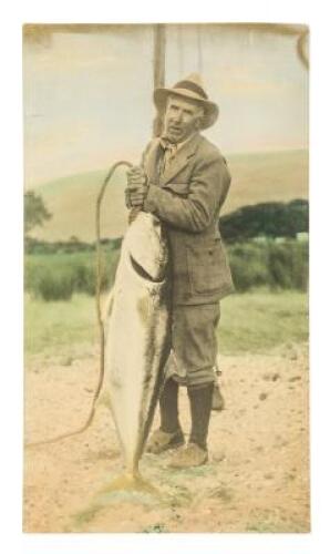 Color-tinted enlargement of a photograph of Zane Grey with an 82 pound Yellowtail