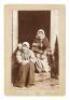 Original photograph of two Alaskan Tlingit women seated in a doorway