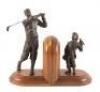 Pair of bookends depicting and golfer and his caddie