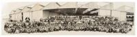 Panoramic photograph of the employees of the Vultee Aircraft Company grouped in front of a large hangar, with one of the company's airplanes