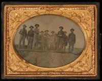 Ambrotype of a detachment of ten Civil War artillerymen, apparently Confederate, standing by their cannon, ramrod in the barrel