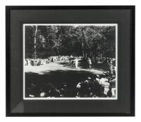 Photograph of Bobby Jones sinking the Grand Slam winning putt at Merion, 1930