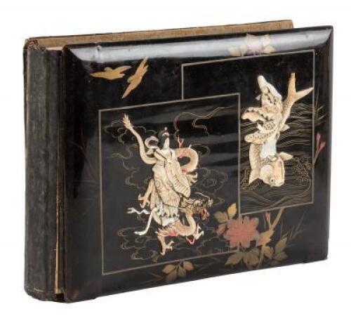 Japanese lacquered album with elaborate bone and mother-of-pearl carved insets on cover, hand-painted silk mats within