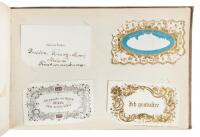 Album of 113 business cards, calling cards, membership cards, etc., kept by an official with the Spanish government