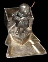 Art deco silver ashtray and match holder, featuring a lady golfer statue