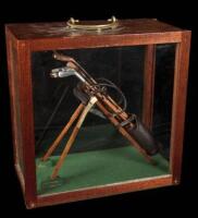 Model of the Automaton Caddie with clubs and display case