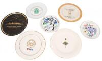 Twelve commemorative plates from various golfing events and organizations
