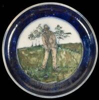 Stoneware plate with incised golfing scene