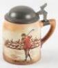 Lidded stein with hand-painted golfing scene