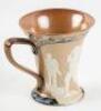 Stoneware fluted stein with relief illustration of golfers