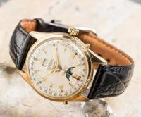 ANGELUS: An Automatic Day-Date Moonphase Gold-Plated Wristwatch with Stainless Steel Caseback