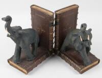 Pair of metal elephants with books