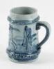 Stoneware stein with golfing scene