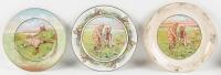 Three ceramic plates with humorous golfing scenes