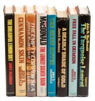 Eight titles by John D. MacDonald