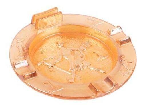 Vintage glass ashtray with relief image of a golfer