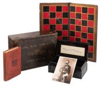 Possessions of Edward Settle Godfrey with his Checkers board and book A Complete Guide to the Game of Draughts (Checkers)