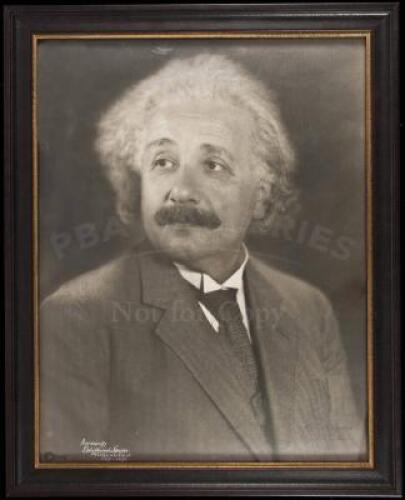 Large photographic portrait of Albert Einstein, inscribed and signed by him in ink to the photographer